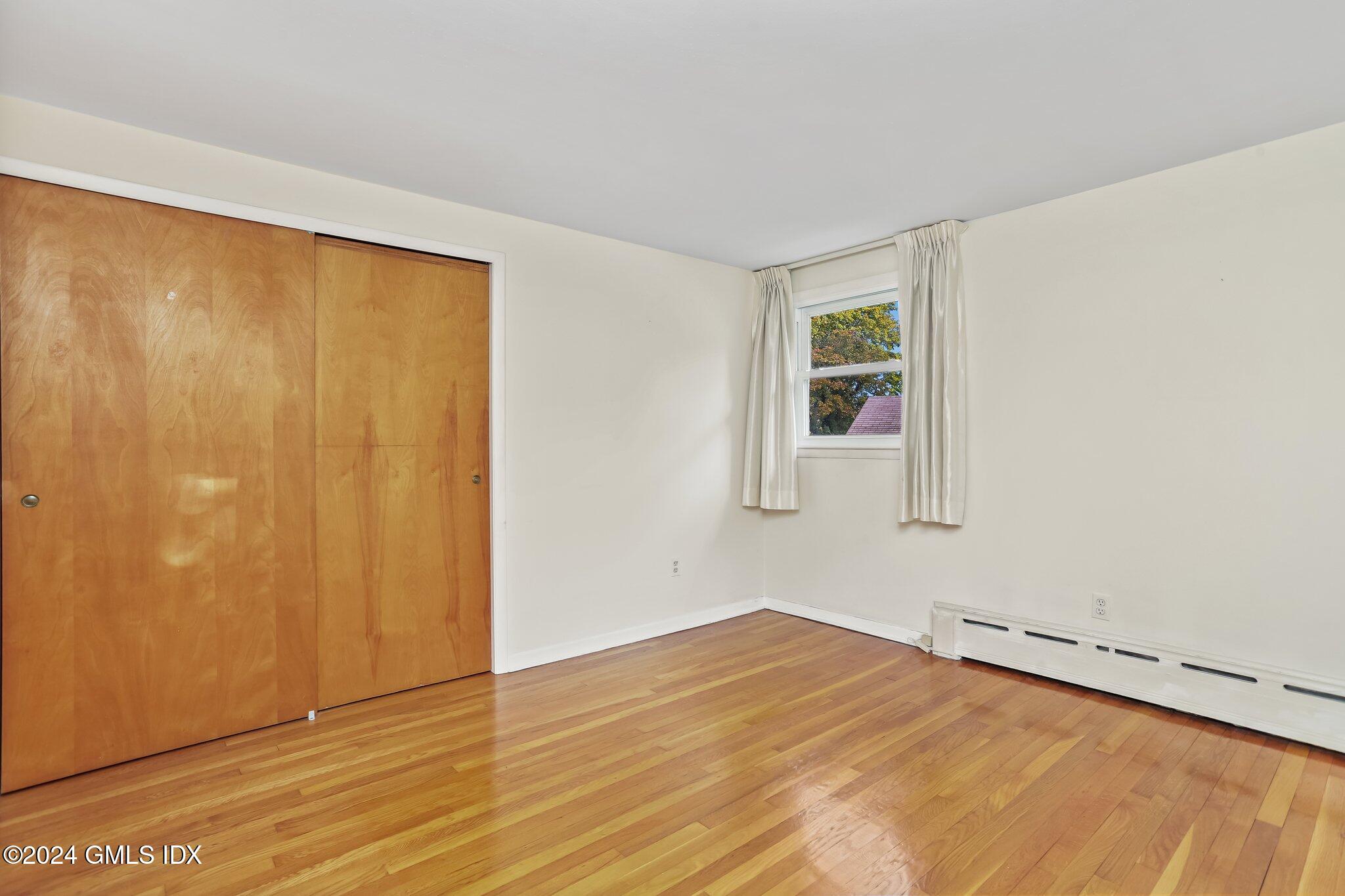 20 Norias Road Greenwich, CT 06830 - Photo 21 of 40 a view of a room with a wooden floor and a window