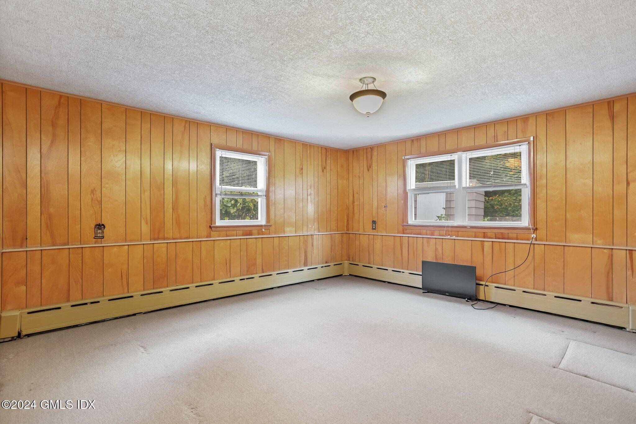 20 Norias Road Greenwich, CT 06830 - Photo 28 of 40 an empty room with windows