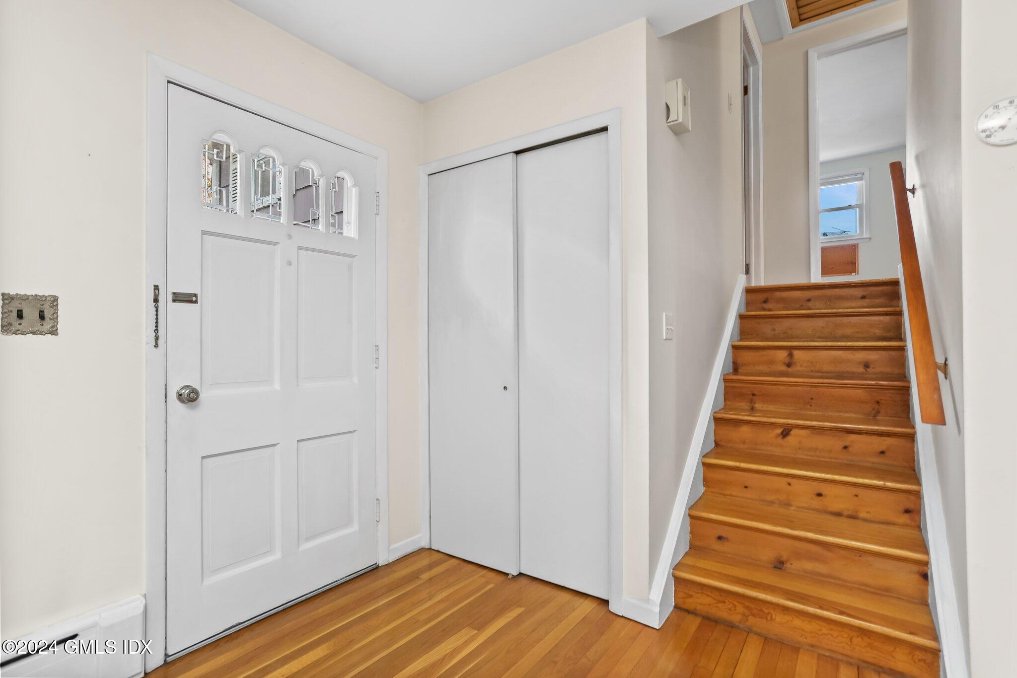 20 Norias Road Greenwich, CT 06830 - Photo 3 of 40 a view of a hallway with wooden floor and entryway