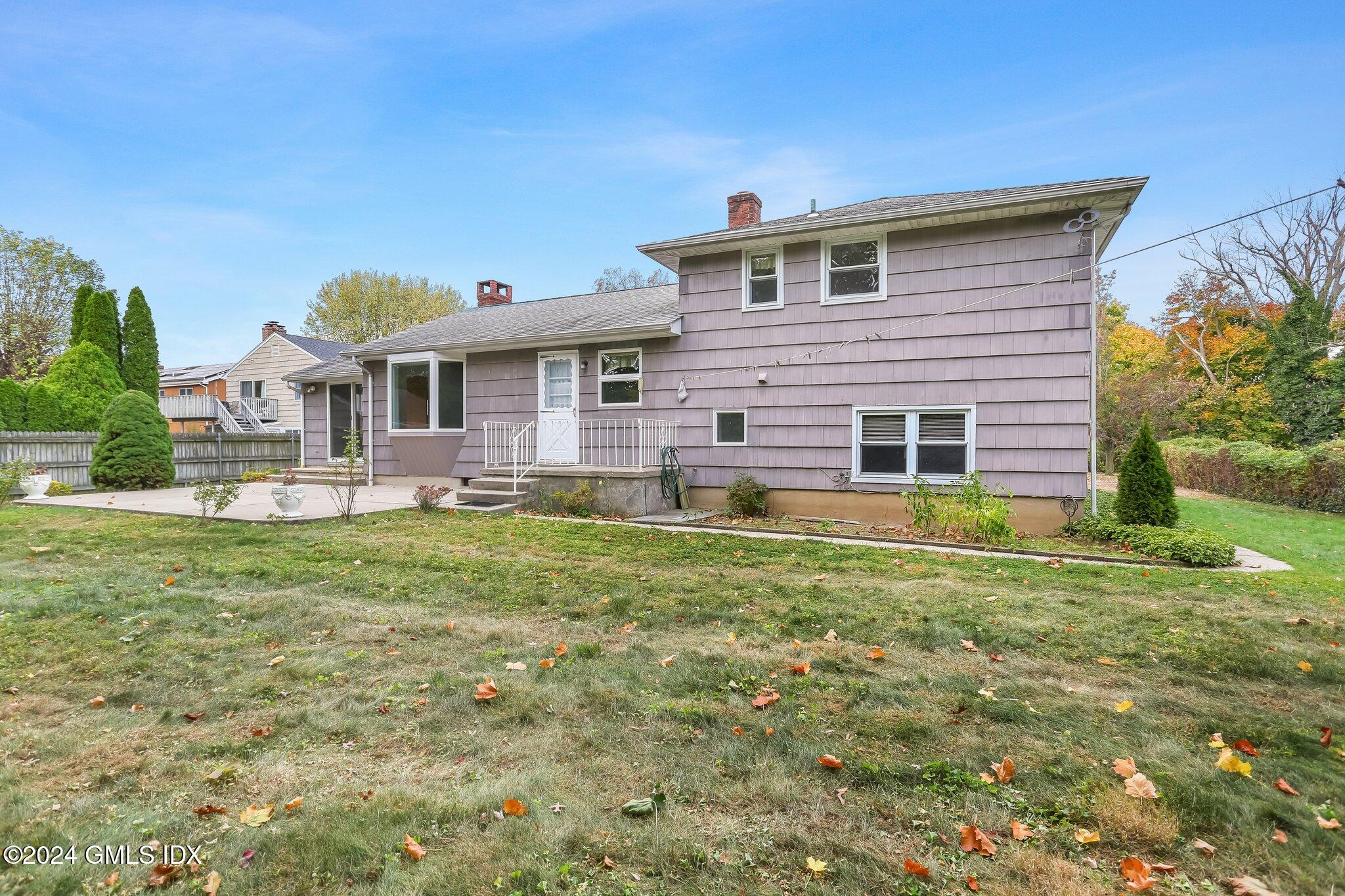20 Norias Road Greenwich, CT 06830 - Photo 35 of 40 a front view of a house with a yard