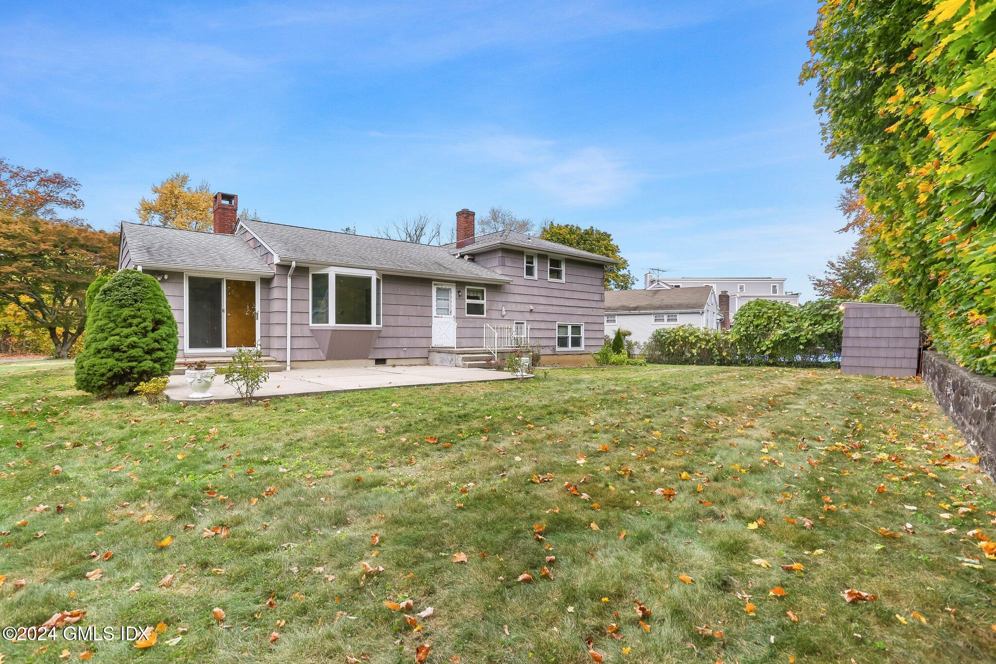 20 Norias Road Greenwich, CT 06830 - Photo 36 of 40 a front view of a house with a yard