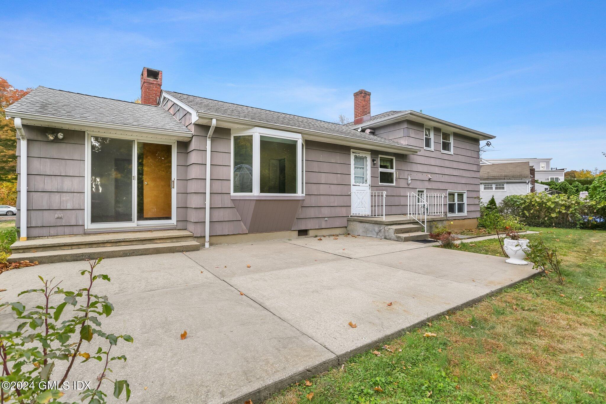 20 Norias Road Greenwich, CT 06830 - Photo 37 of 40 front view of a house with a patio