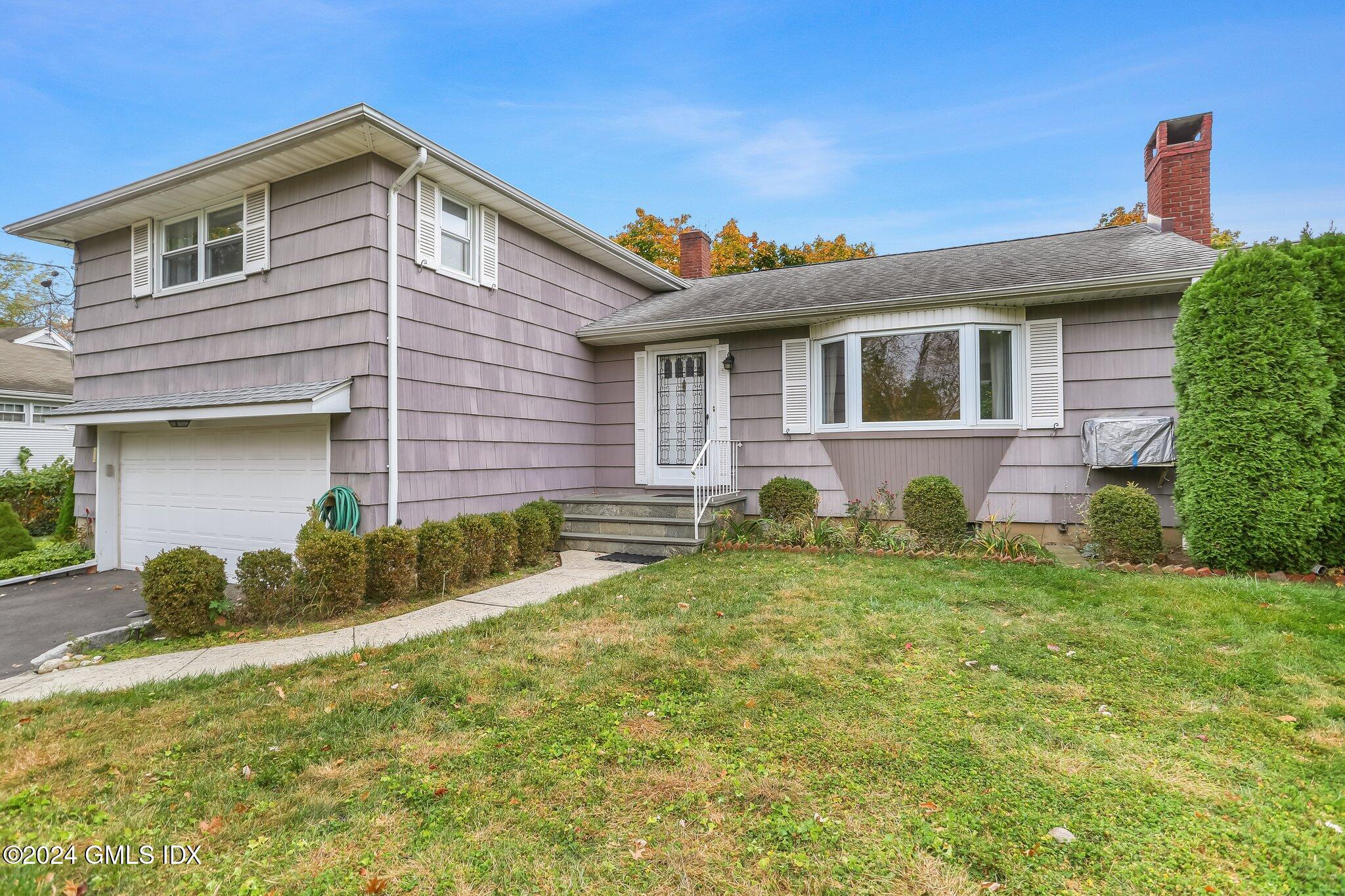 20 Norias Road Greenwich, CT 06830 - Photo 40 of 40 a front view of a house with garden