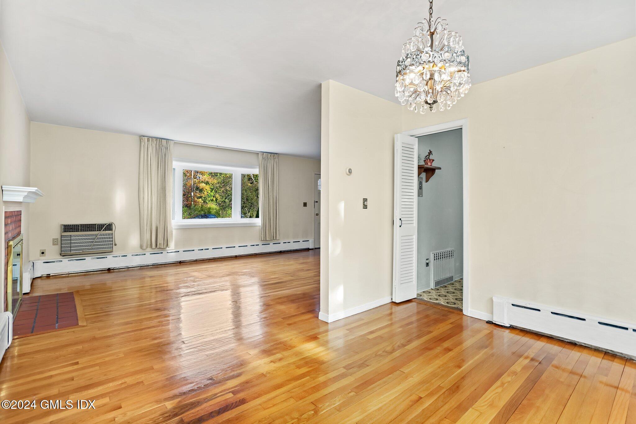 20 Norias Road Greenwich, CT 06830 - Photo 9 of 40 a view of empty room with wooden floor and fan