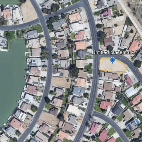 an aerial view of a residential building with an outdoor space