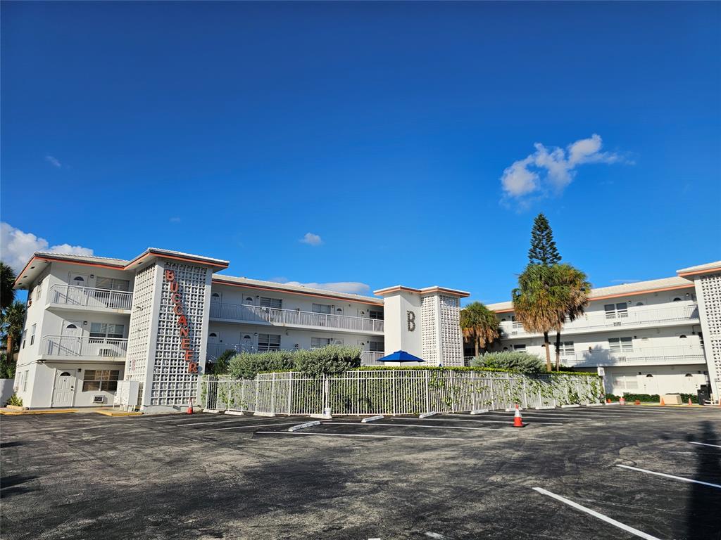 120 Northeast 20th Avenue, Unit 3 Deerfield Beach, FL 33441 - Photo 14 of 14 a front view of a building with a street