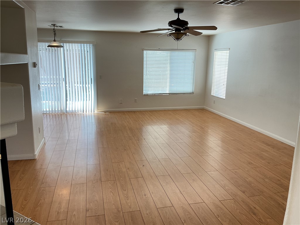 10975 Calcedonian Street Las Vegas, NV 89141 - Photo 9 of 25 This airy room features durable flooring and abundant natural light, creating a bright living space.