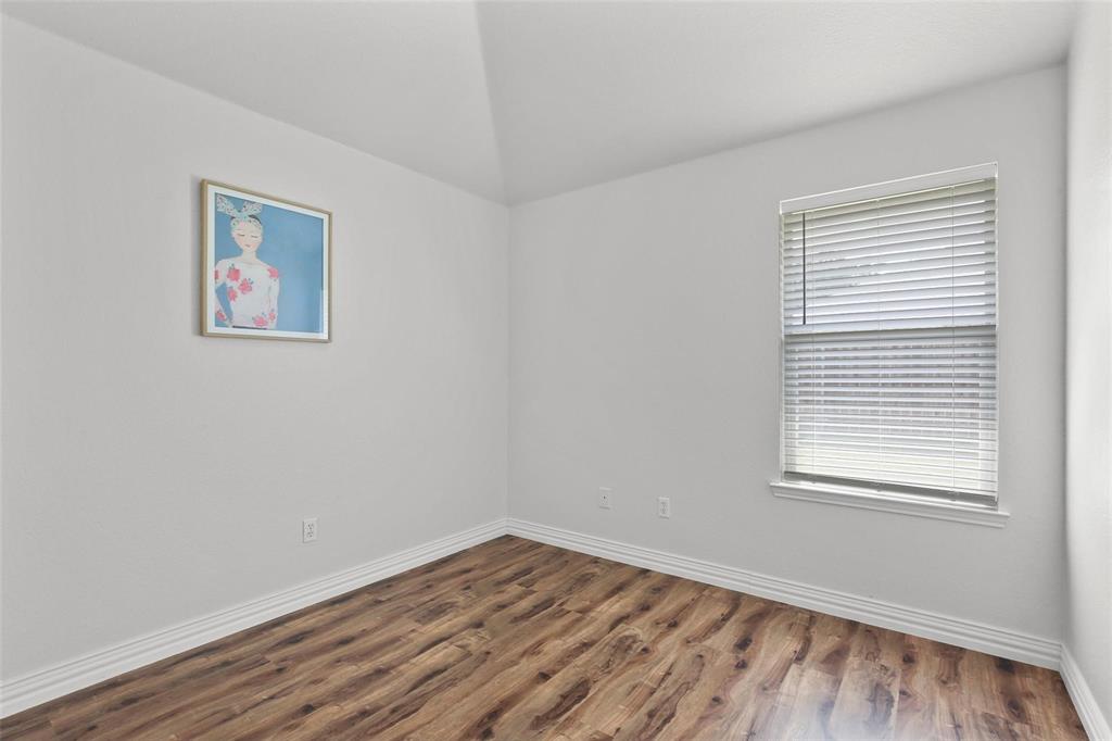 5961 Cheyenne Way Frisco, TX 75034 - Photo 28 of 33 Room featuring wood-finish flooring, white baseboards, and a window with horizontal blinds