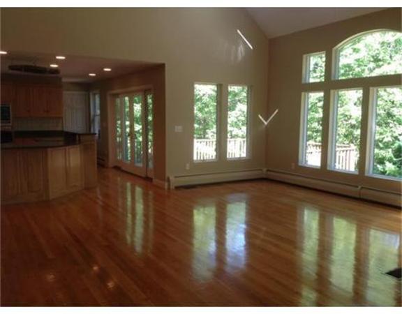 10 Sgt Roode Lane Middleton, MA 01949 - Photo 9 of 26 a view of an empty room with wooden floor and a window