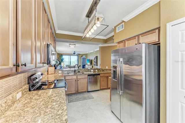 a view of a dining room with furniture wooden floor and chandelier