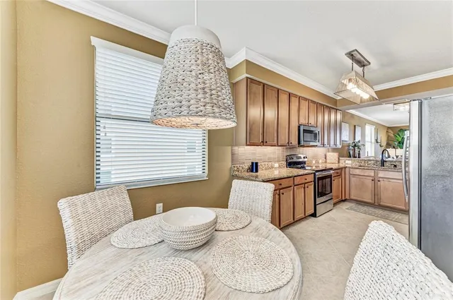 an aerial view of a house with a garden and lake view