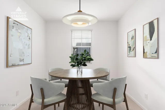 a dining room with furniture and window