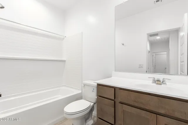 a bathroom with a sink a toilet and a bathtub