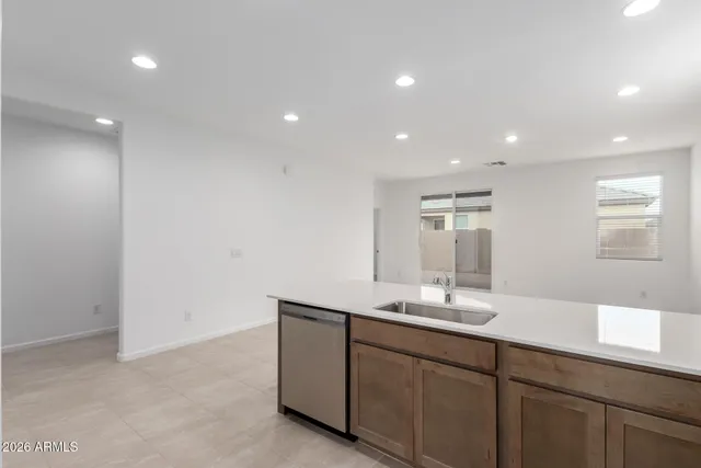 a bathroom with a double vanity sink and mirror