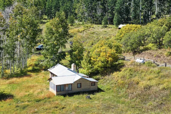 a aerial view of a house with a yard