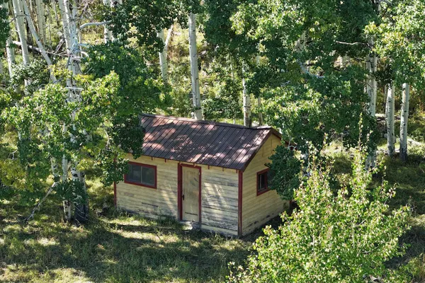 a bedroom with a bed and a table in it
