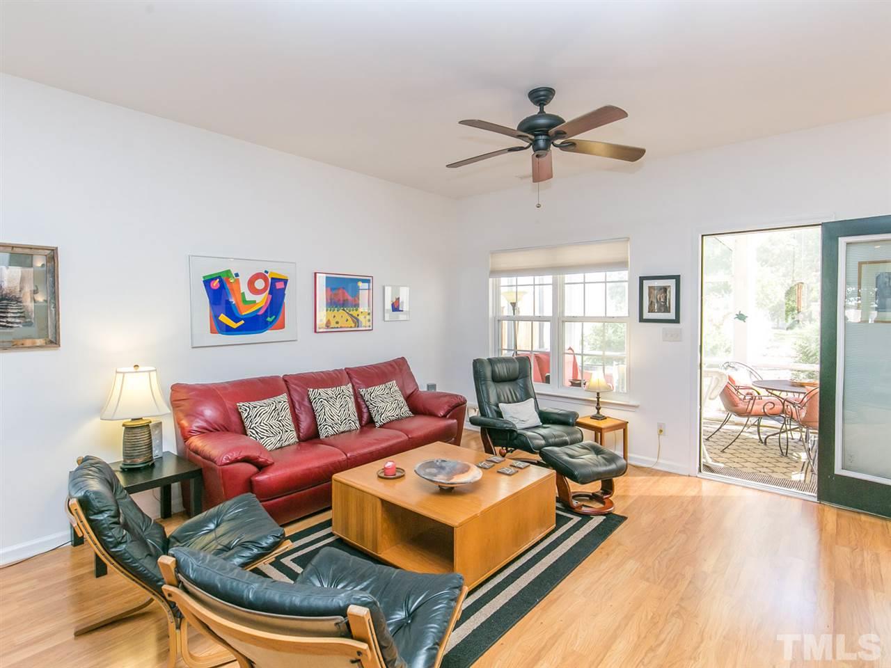2128 Persimmon Ridge Drive Raleigh, NC 27604 - Photo 2 of 25 Newer laminate floors add high end looks with easy maintenance to the home. The screened porch beckons through the french door.