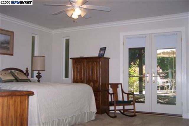 741 North Manley Road Ripon, CA 95366 - Photo 4 of 9 a bedroom with a bed and a mirror