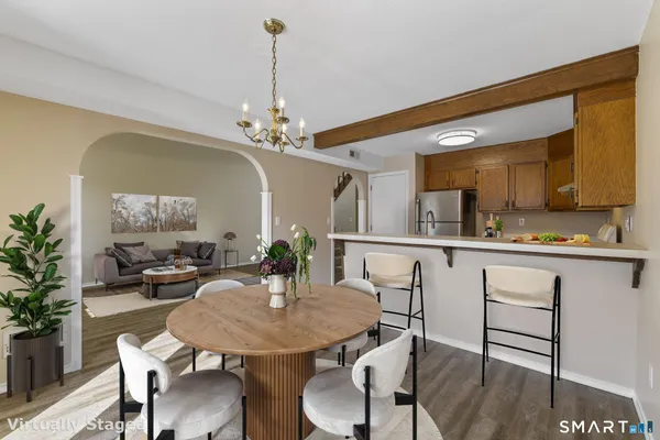 a view of a dining room with furniture and wooden floor
