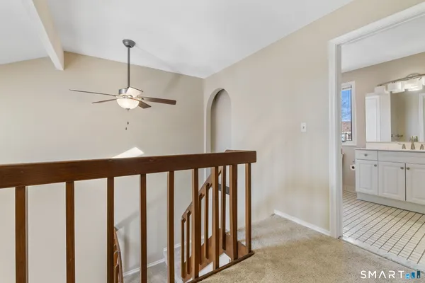 a view of a hallway with a chandelier