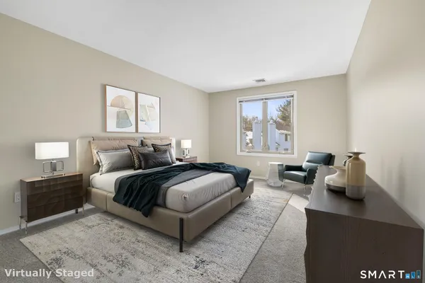 a bedroom with a bed and window