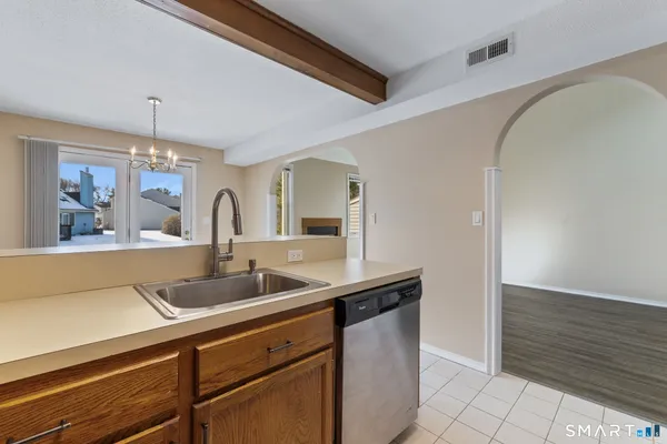 a kitchen with a sink and a refrigerator
