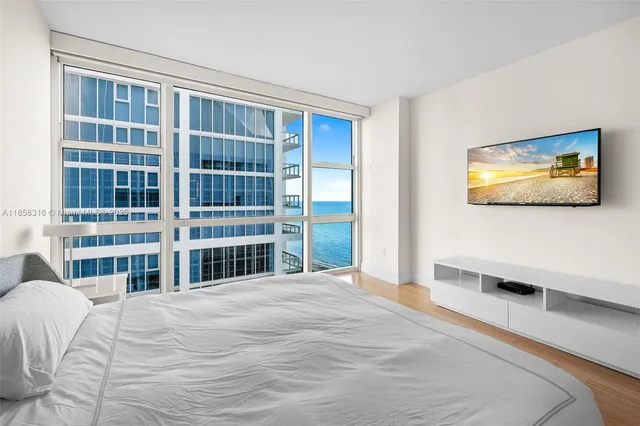 a bathroom with a shower sink vanity and mirror