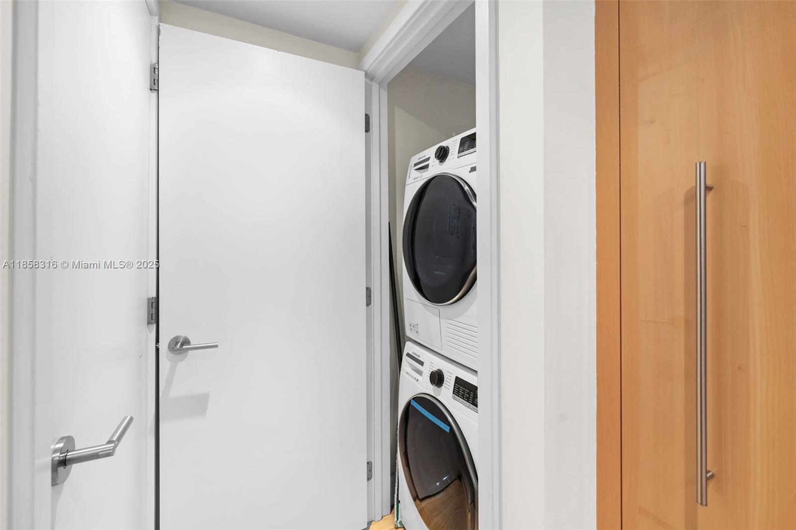 6801 Collins Avenue, Unit DOOR1409 Miami Beach, FL 33141 - Photo 9 of 21 a close up view of a washer and dryer