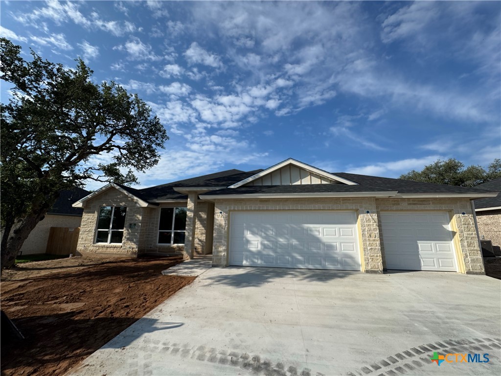 1319 Rylee Lane Salado, TX 76571 - Photo 1 of 17 a front view of a house with a yard and garage