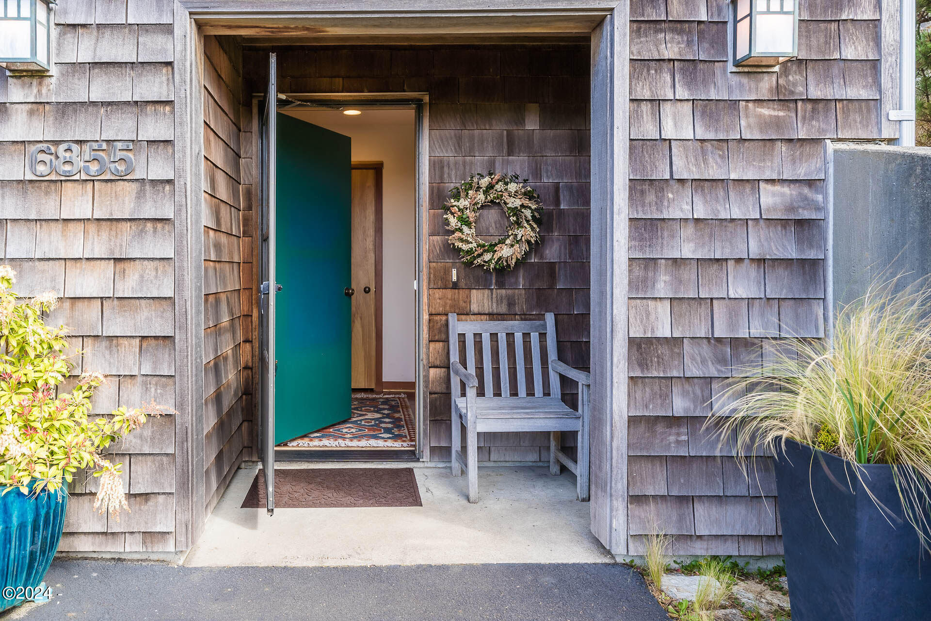 6855 Nestucca Ridge Road Pacific City, OR 97135 - Photo 7 of 44 a view of a house with a large window and wooden floor