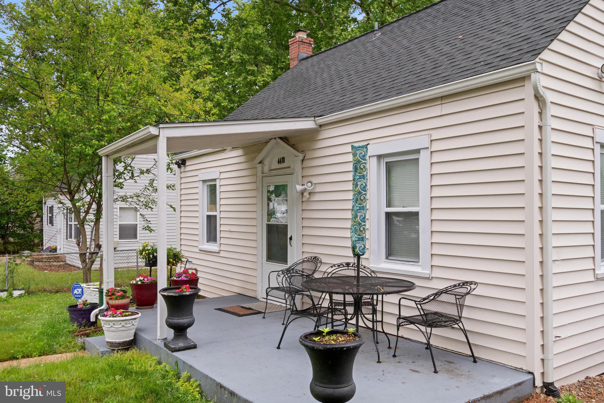 4410 Allies Road Suitland, MD 20746 - Photo 2 of 30 a view of a patio with table and chairs and potted plants