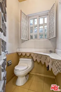 a bathroom with a toilet sink and bathtub