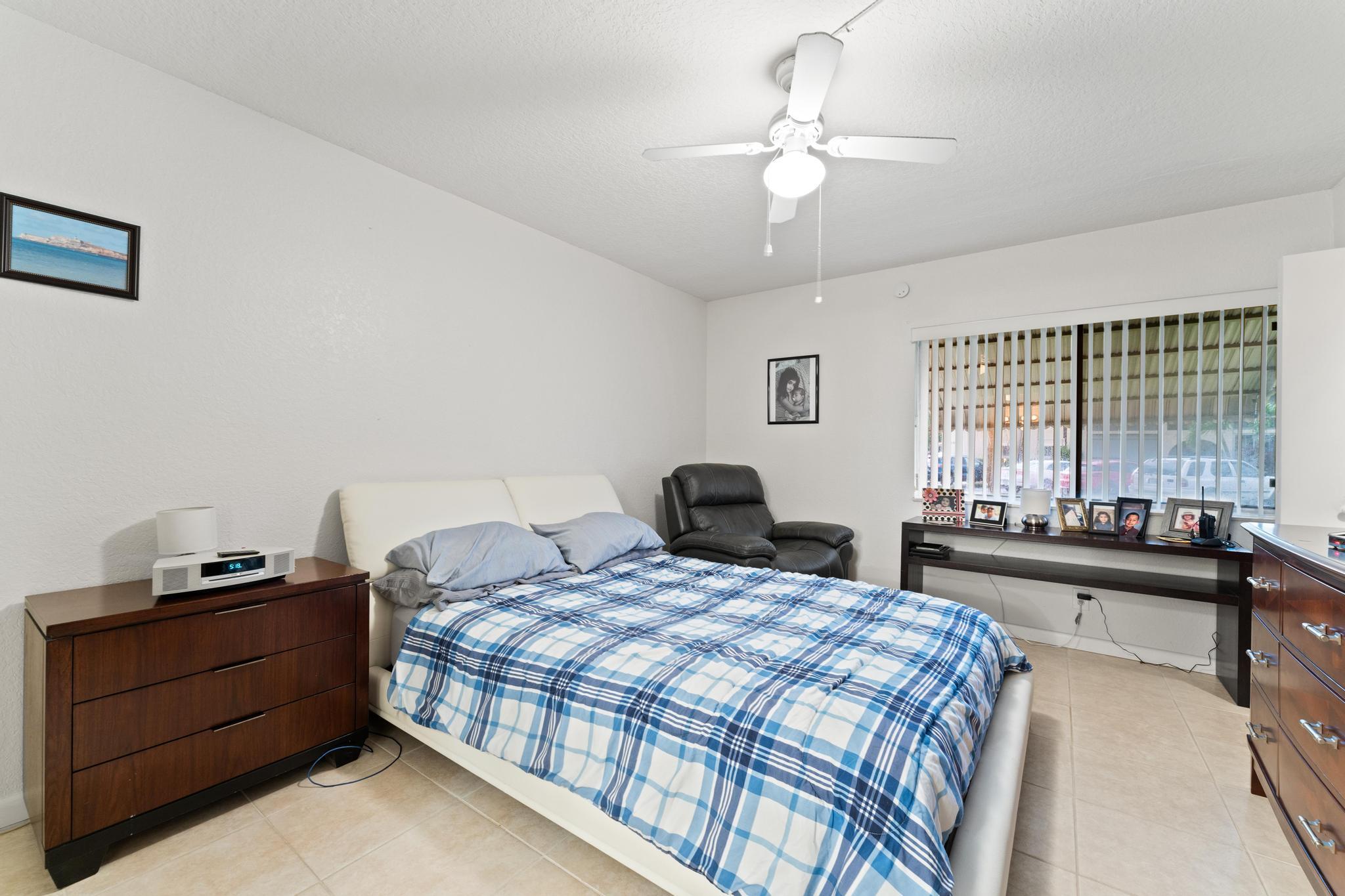 341 Pine Ridge Circle, Unit D1 Greenacres, FL 33463 - Photo 22 of 28 Primary Bedroom