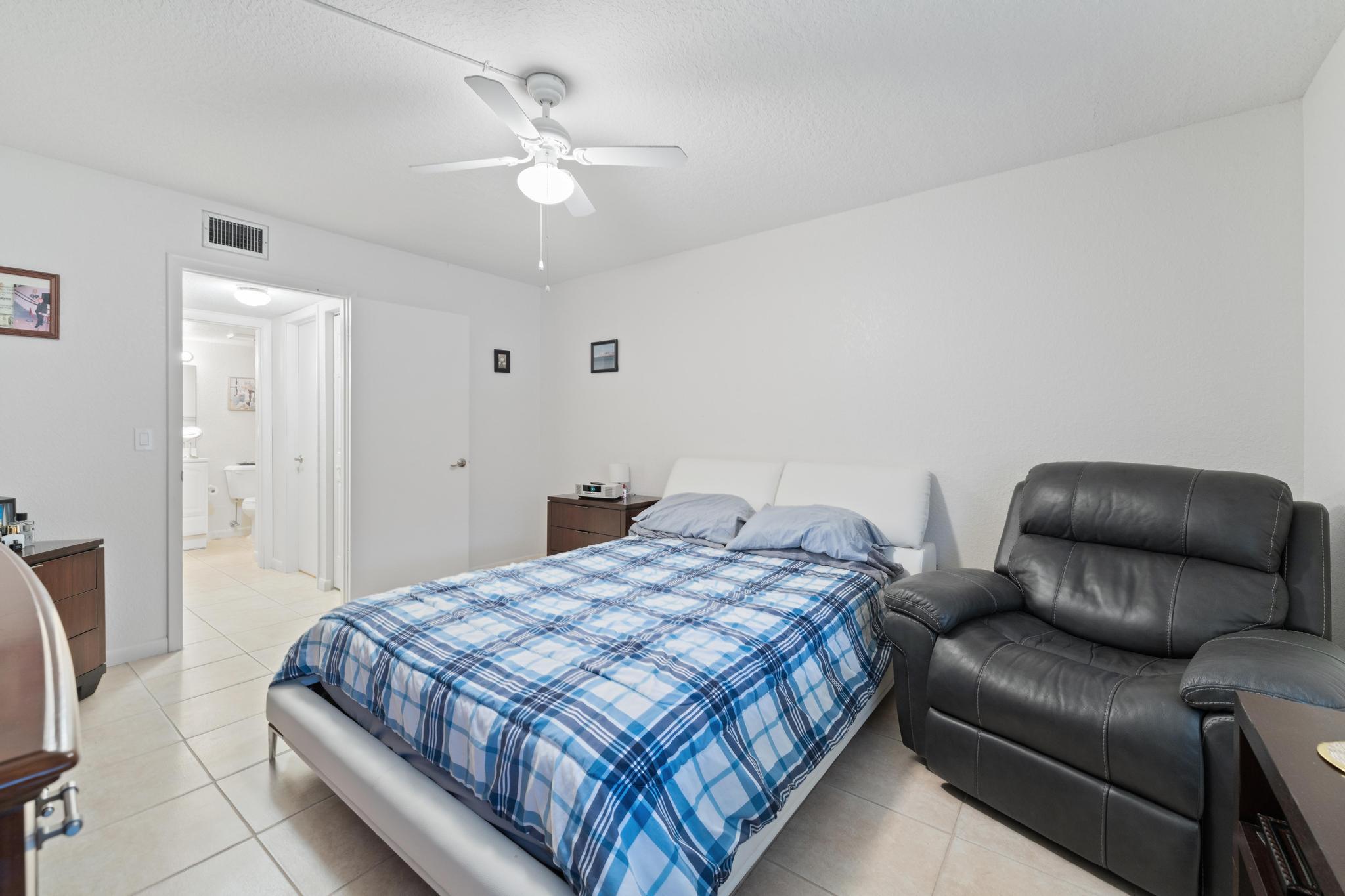 341 Pine Ridge Circle, Unit D1 Greenacres, FL 33463 - Photo 23 of 28 Primary Bedroom