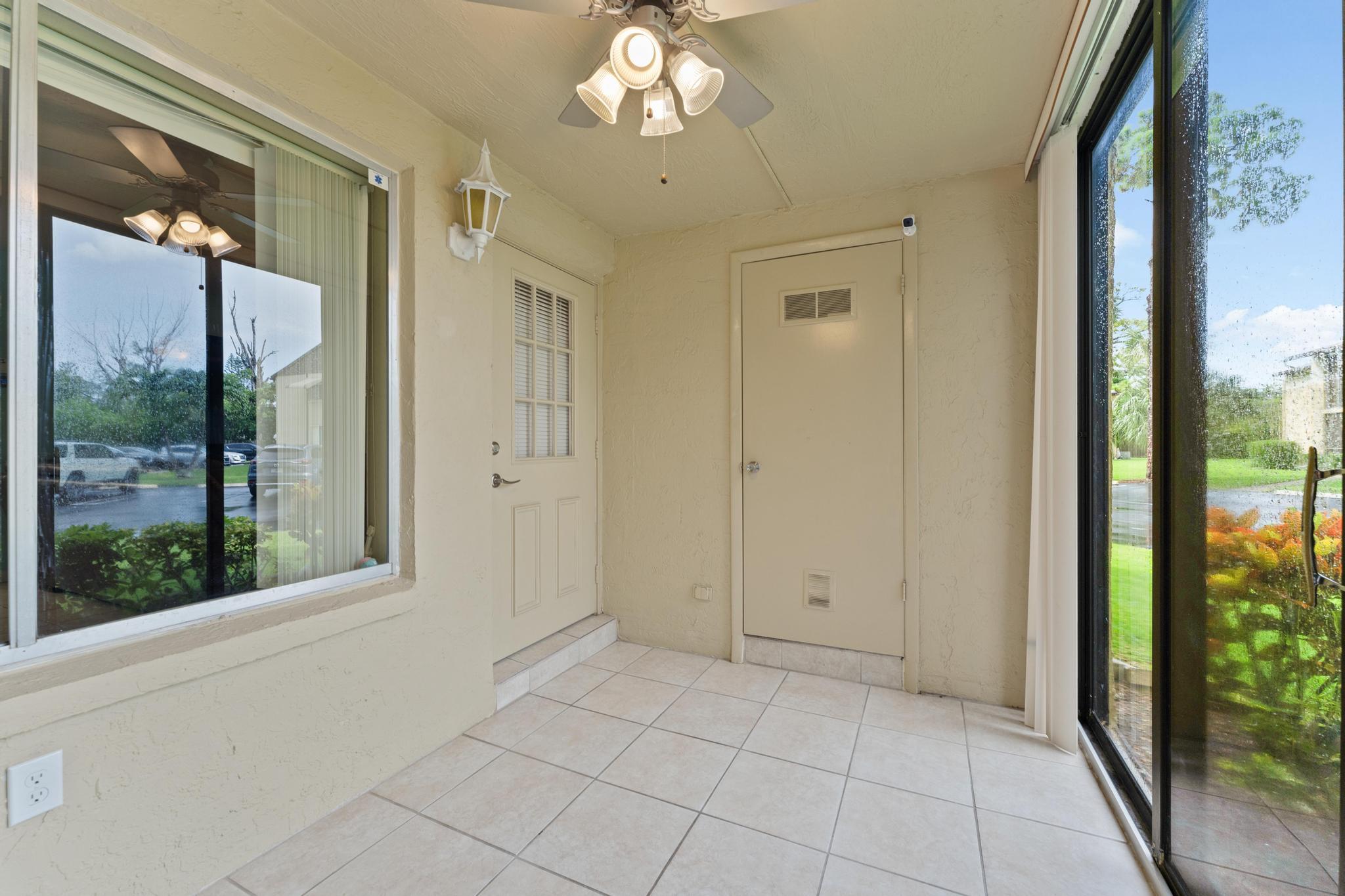341 Pine Ridge Circle, Unit D1 Greenacres, FL 33463 - Photo 4 of 28 Screened Patio