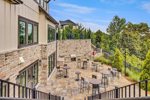 a view of balcony with furniture