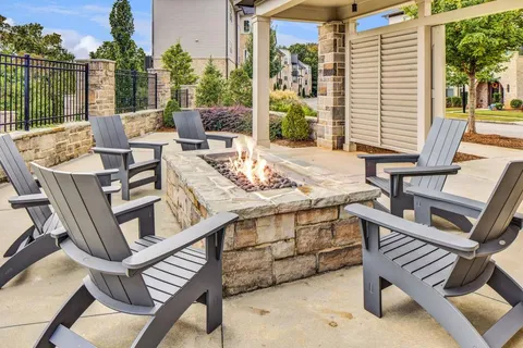 a view of an outdoor sitting area with furniture and wooden floor