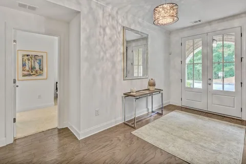 an empty room with windows and closet