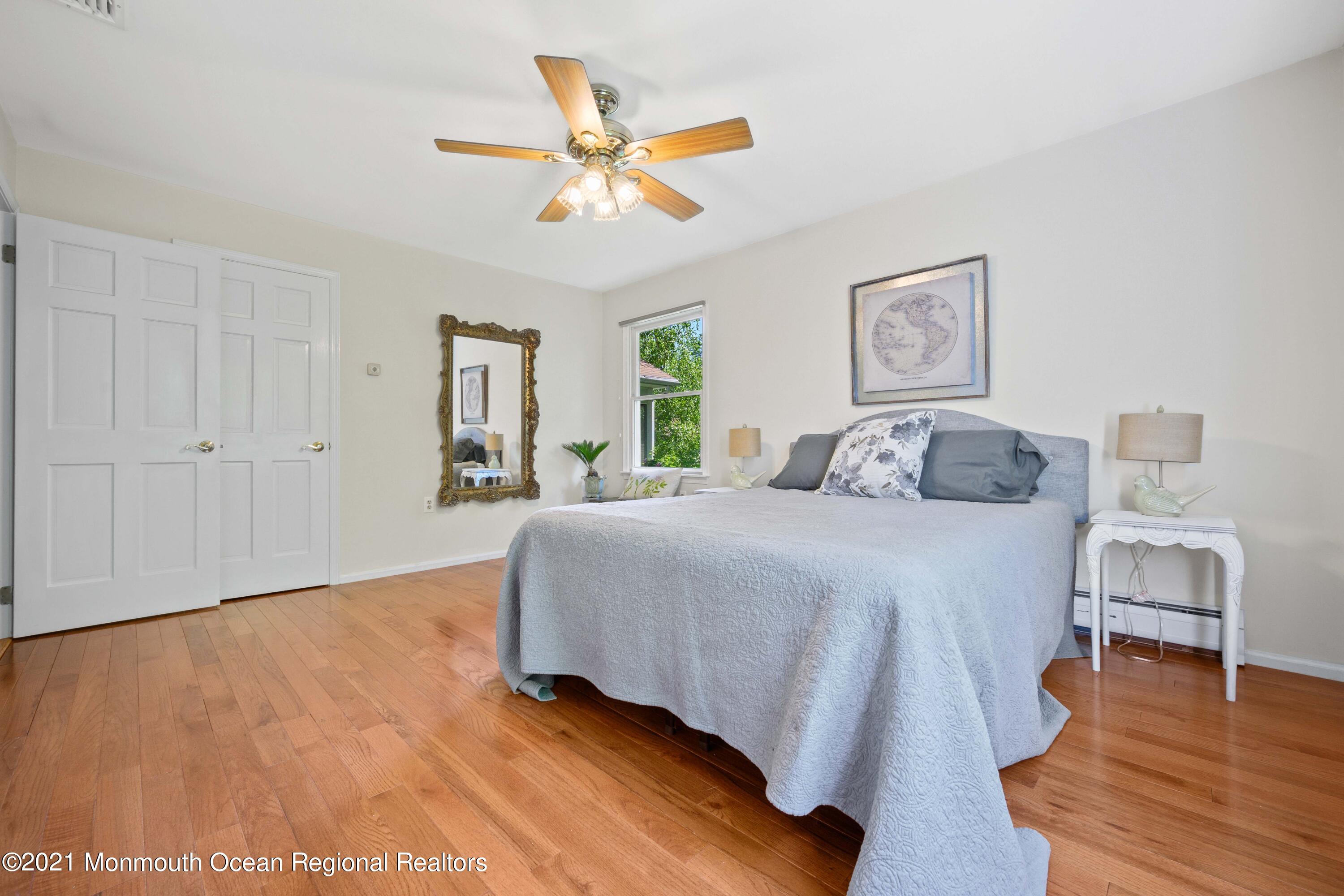 142 Manners Road Flemington, NJ 08822 - Photo 14 of 38 a bedroom with a bed and a chandelier
