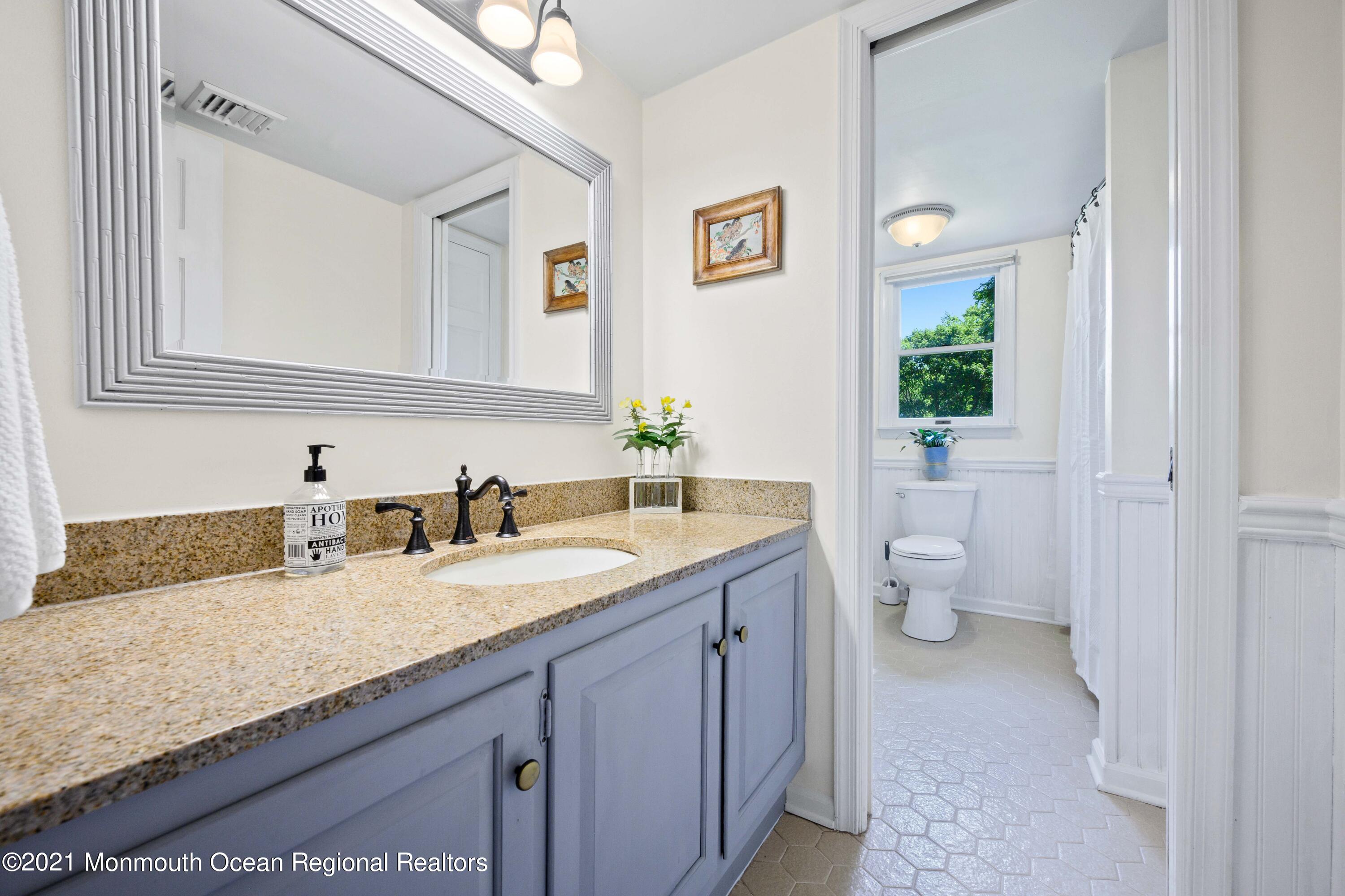 142 Manners Road Flemington, NJ 08822 - Photo 17 of 38 a bathroom with a granite countertop sink and a mirror