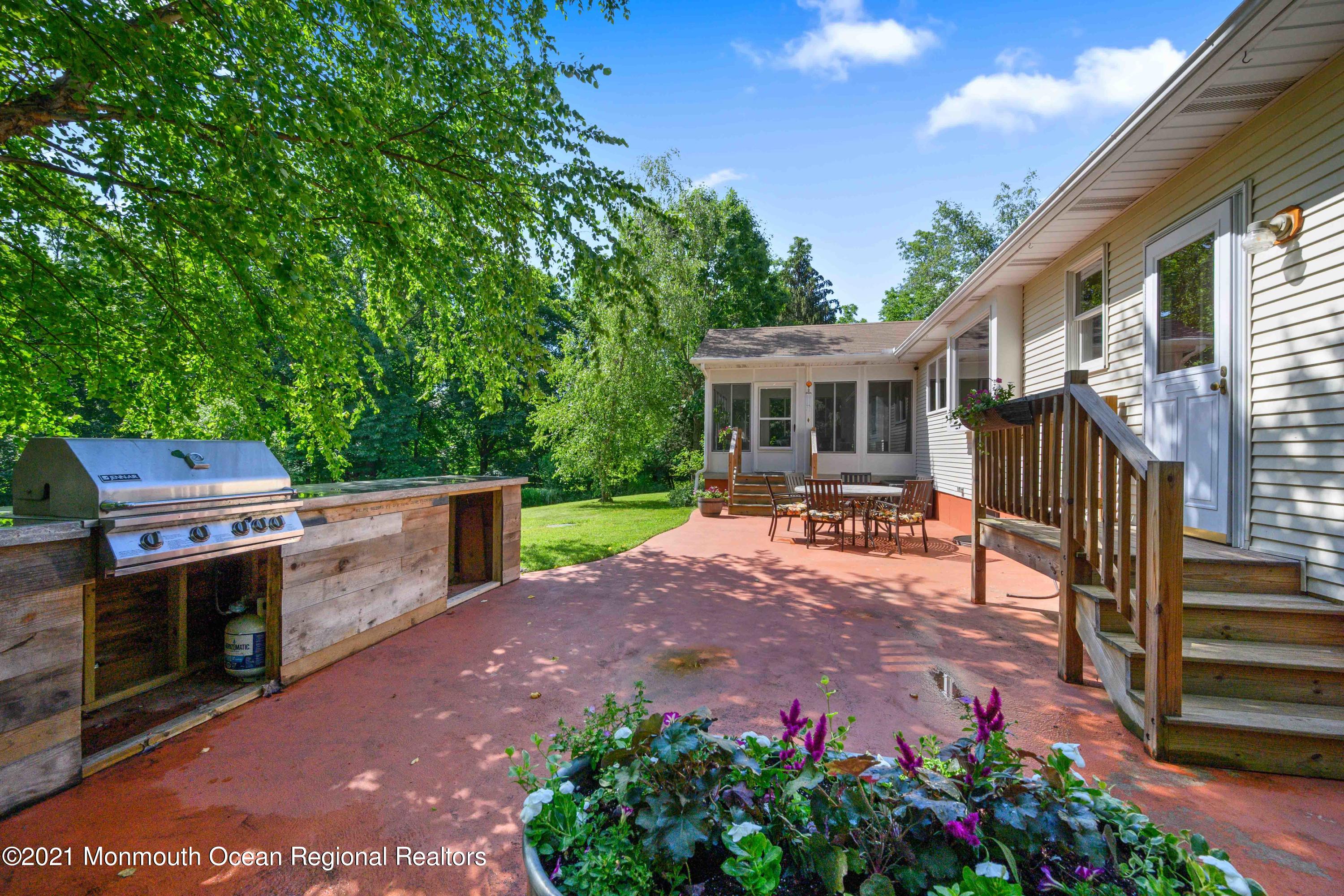 142 Manners Road Flemington, NJ 08822 - Photo 28 of 38 a view of a house with a porch and a yard