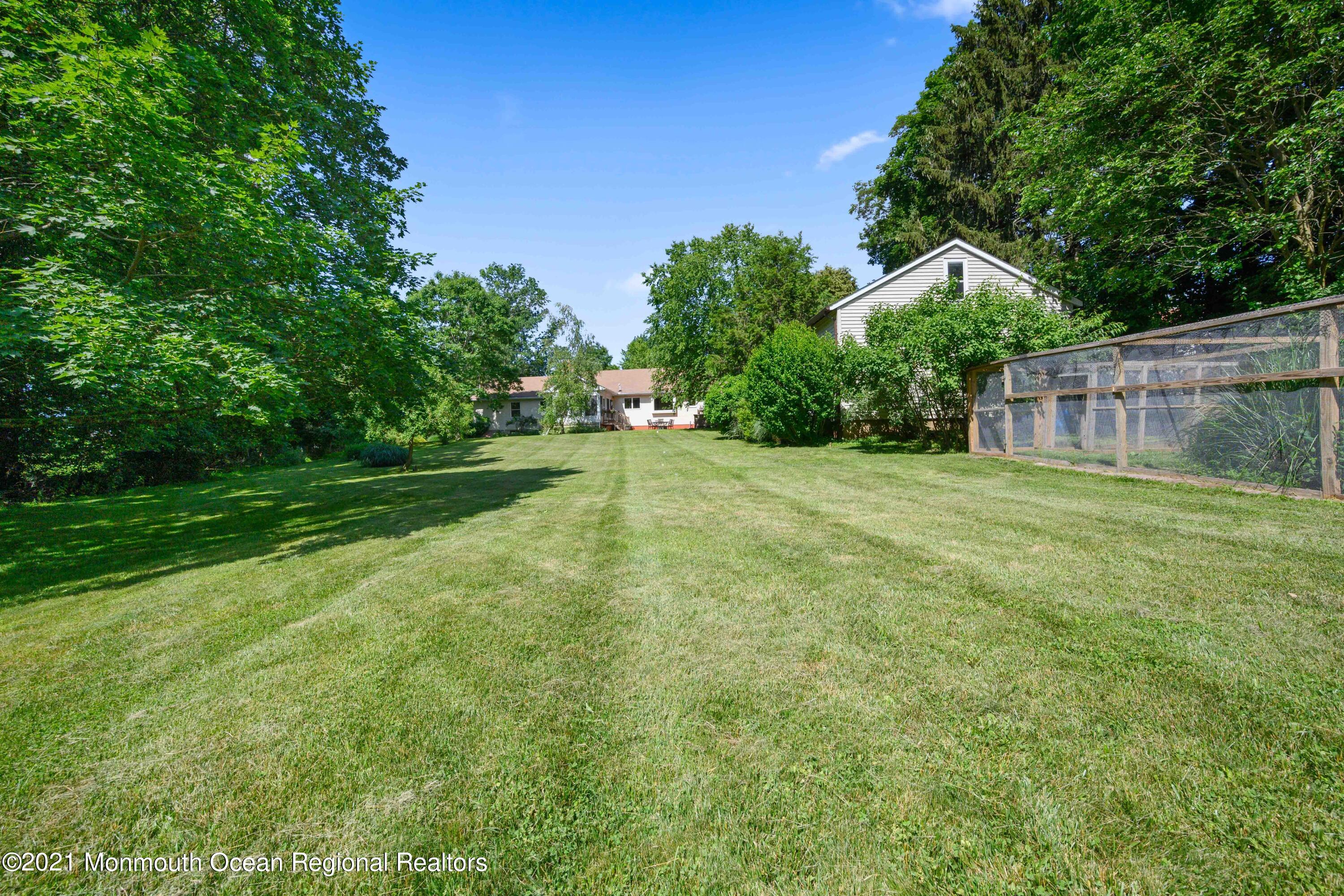 142 Manners Road Flemington, NJ 08822 - Photo 36 of 38 a view of a backyard with a trees
