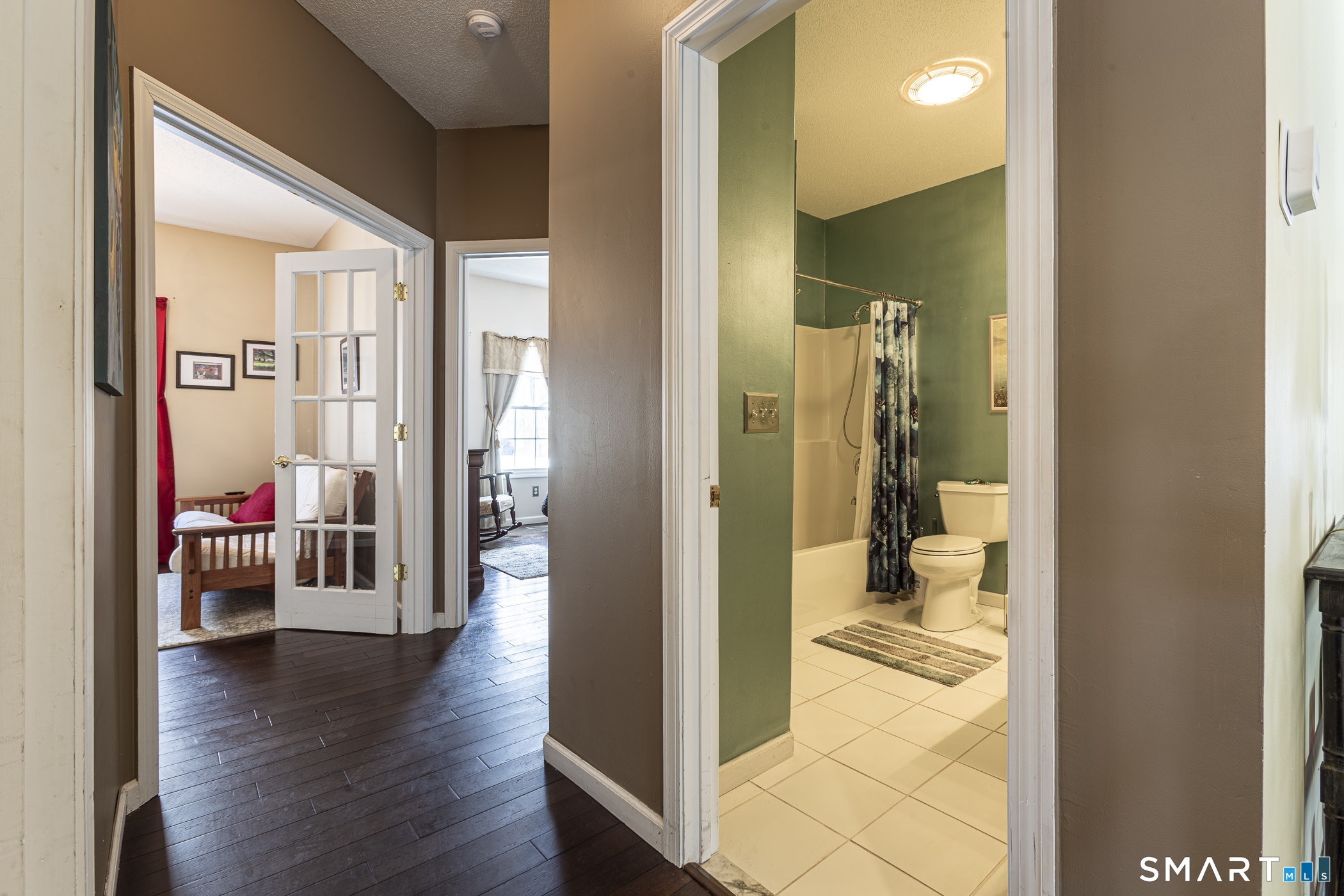 99 Oliver Way, Unit 99 Bloomfield, CT 06002 - Photo 19 of 40 Full bath main floor and hallway leading to office/bedroom