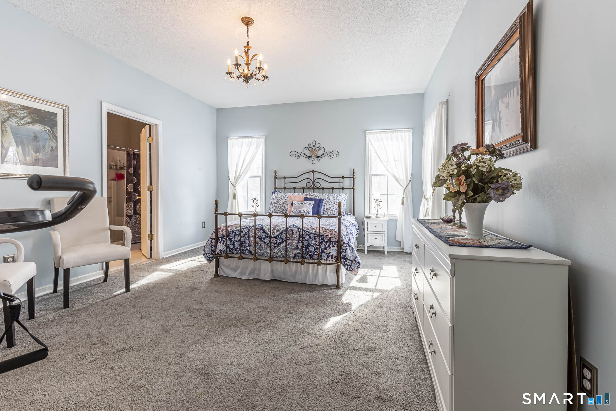 99 Oliver Way, Unit 99 Bloomfield, CT 06002 - Photo 23 of 40 Primary bedroom with French doors to the patio