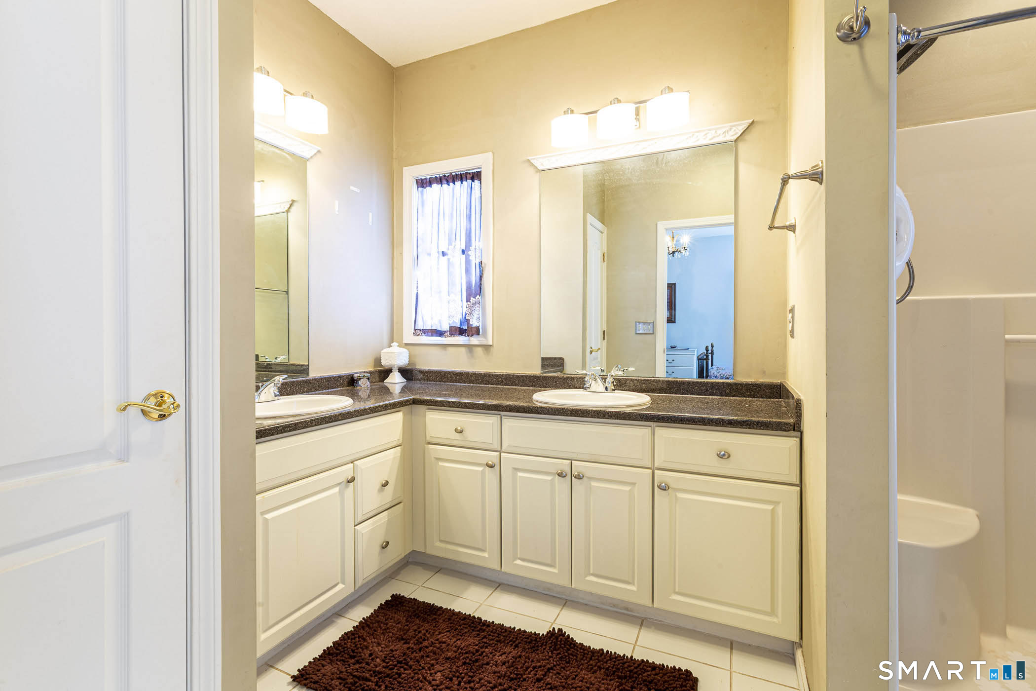 99 Oliver Way, Unit 99 Bloomfield, CT 06002 - Photo 25 of 40 Double sink bathroom vanity in primary bedroom ensuite