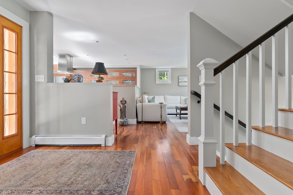 11 Beacon Street Amesbury, MA 01913 - Photo 13 of 42 a view of a livingroom with wooden floor and furniture