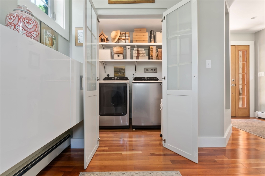 11 Beacon Street Amesbury, MA 01913 - Photo 15 of 42 a view of a kitchen with fridge and wooden floor