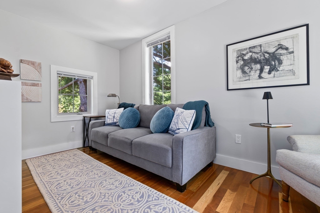 11 Beacon Street Amesbury, MA 01913 - Photo 20 of 42 a living room with furniture and a window
