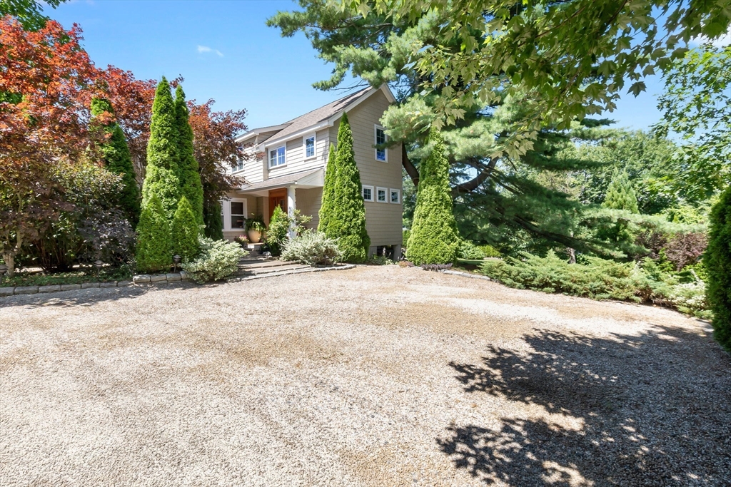 11 Beacon Street Amesbury, MA 01913 - Photo 2 of 42 a view of a building with a tree