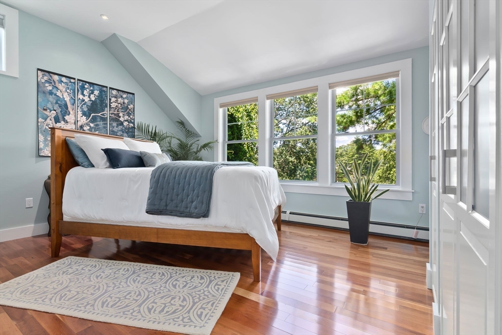 11 Beacon Street Amesbury, MA 01913 - Photo 22 of 42 a living room with a couch and a table